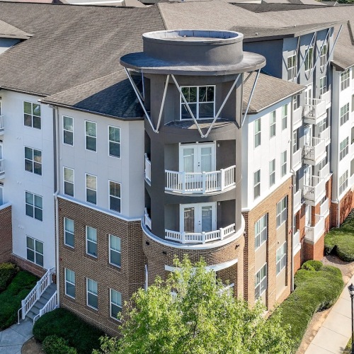 The essence of exceptional living a building surrounded by many trees