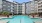 a swimming pool in front of a building