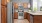 a kitchen with wooden cabinets