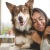 a woman hugging her dog