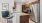 a kitchen with a fridge and a chair