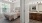 a bedroom with a large mirror